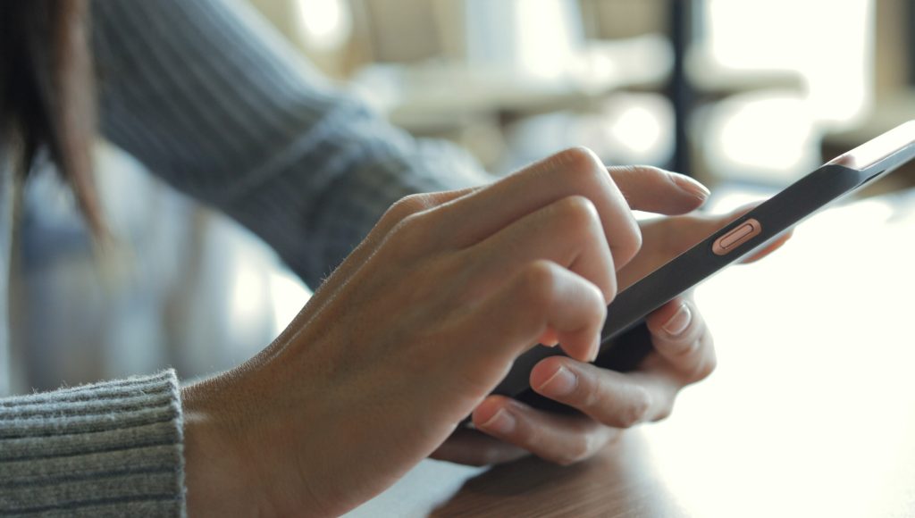 Close up of woman using mobile phone