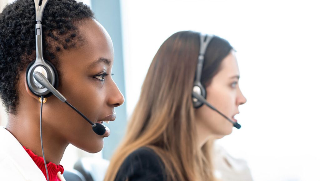Group of diverse telemarketing customer service staff team in call center banner background